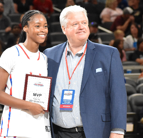 All-Star games director Mike Broughton (right) with 2023 girls' game MVP, Miss Basketball Laila Hull of Zionsville.