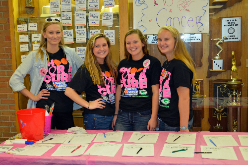 Volunteers work a donation table at a