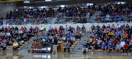 Purdue men's coach Matt Painter (foreground) speaks to a large gathering of coaches at the 2023 IBCA Clinic.