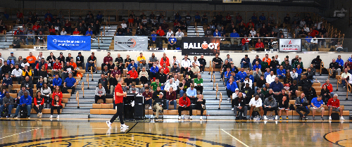 University of Louisville men's coach Pat Kelsey (foreground, red shirt) addresses the coaches who gathered for the IBCA Clinic in April 2024 at Mt. Vernon High School in Fortville, Ind.