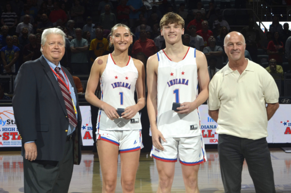 THEY'RE #1: Maya Makalusky of Hamilton Southeastern (second from left) and Braylon Mullins of Greenfield-Central (third from left) receive rings as Indiana Miss Basketball and Indiana Mr. Basketball for 2025. Joining them are Indiana All-Stars game director Mike Broughton (left) and Jostens representative Brad Long.