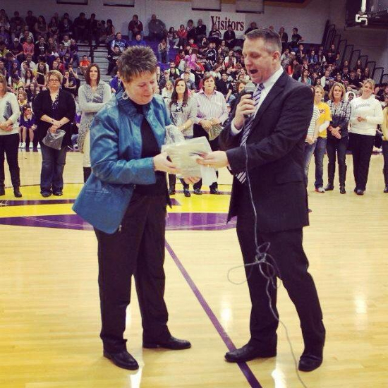 Donna Cheatham (left) receives a plaque on the evening where the Scottsburg court is named in her honor on Nov. 27, 2023. Photo provided by the Scottsburg athletic department.
