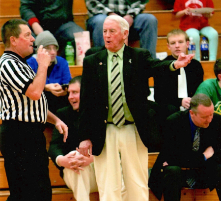 Bill Patrick offers an official some assistance while coaching at Tippecanoe Valley in 2015-16.